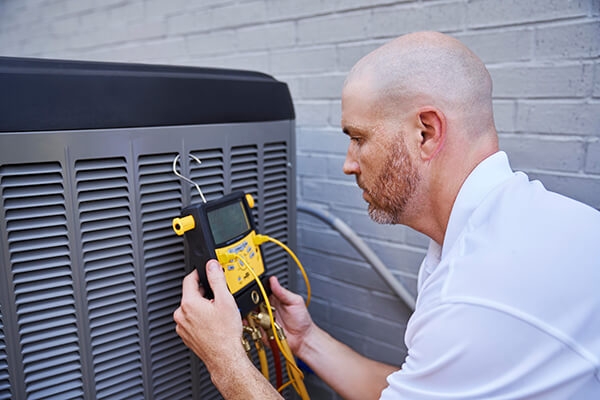 Man working on air conditioner